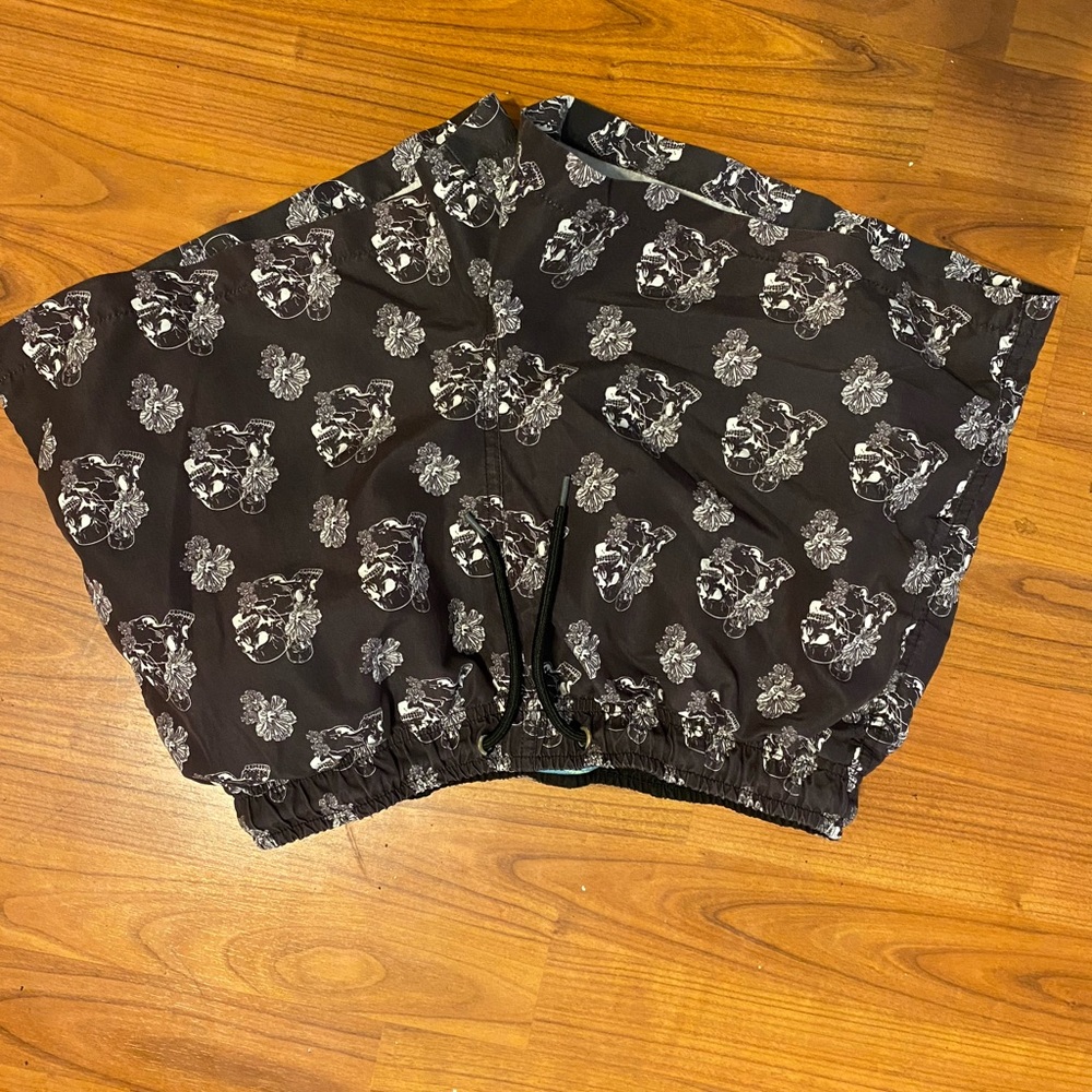 Men’s skull and flower print swim trunks